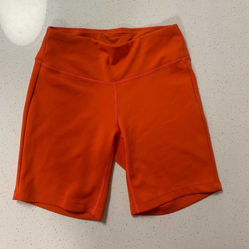 Bright red new balance biker shorts